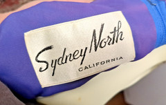Sydney North designed, Hollywood Glamour, Striking V-neck blue party dress