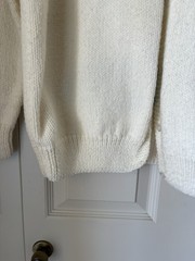 Vintage 1950s hand-knit cardigan. Features a female golfer and ball. Kitchey