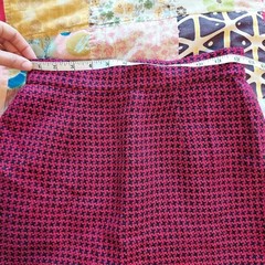 Vintage red, pink, and black houndstooth skirt with zipper and button closure.