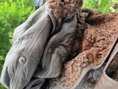 Vintage reversible sheepskin coat made of leather and karakul fur from the 1970s