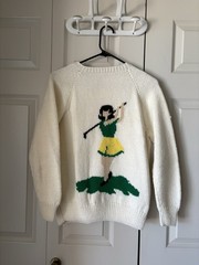 Vintage 1950s hand-knit cardigan. Features a female golfer and ball. Kitchey
