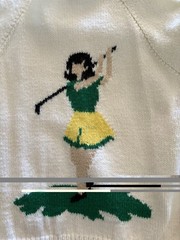 Vintage 1950s hand-knit cardigan. Features a female golfer and ball. Kitchey