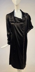 1920’S BLACK SATIN FINISH SILK DRESS W ASYMMETRICAL NECKLINE + BUTTON DETAILING