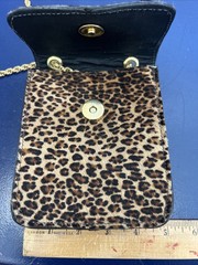 This is a St. Maarten Dallas Leopard Mini Crossbody