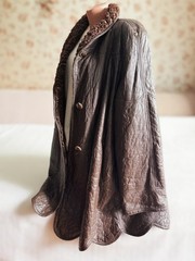 Vintage reversible sheepskin coat made of leather and karakul fur from the 1970s