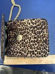 This is a St. Maarten Dallas Leopard Mini Crossbody