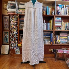 Vintage baby pink long slip with white embroidered and lace details.