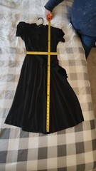 Vintage Black Dress No Tags. Has Shoulder Pads and a Bow on the Side. Rayon