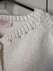 Vintage 1950s hand-knit cardigan. Features a female golfer and ball. Kitchey