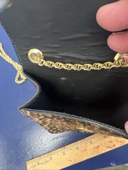 This is a St. Maarten Dallas Leopard Mini Crossbody