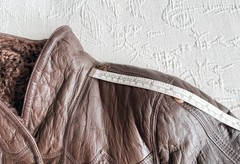 Vintage reversible sheepskin coat made of leather and karakul fur from the 1970s